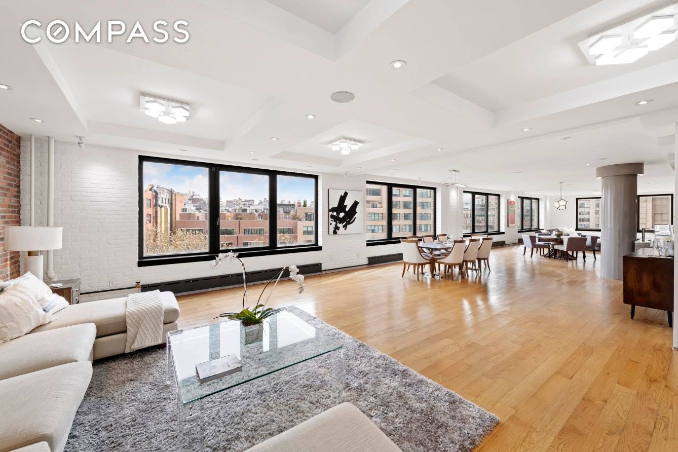 This newly renovated SoHo commercial condo loft exudes a dramatic, modern elegance.