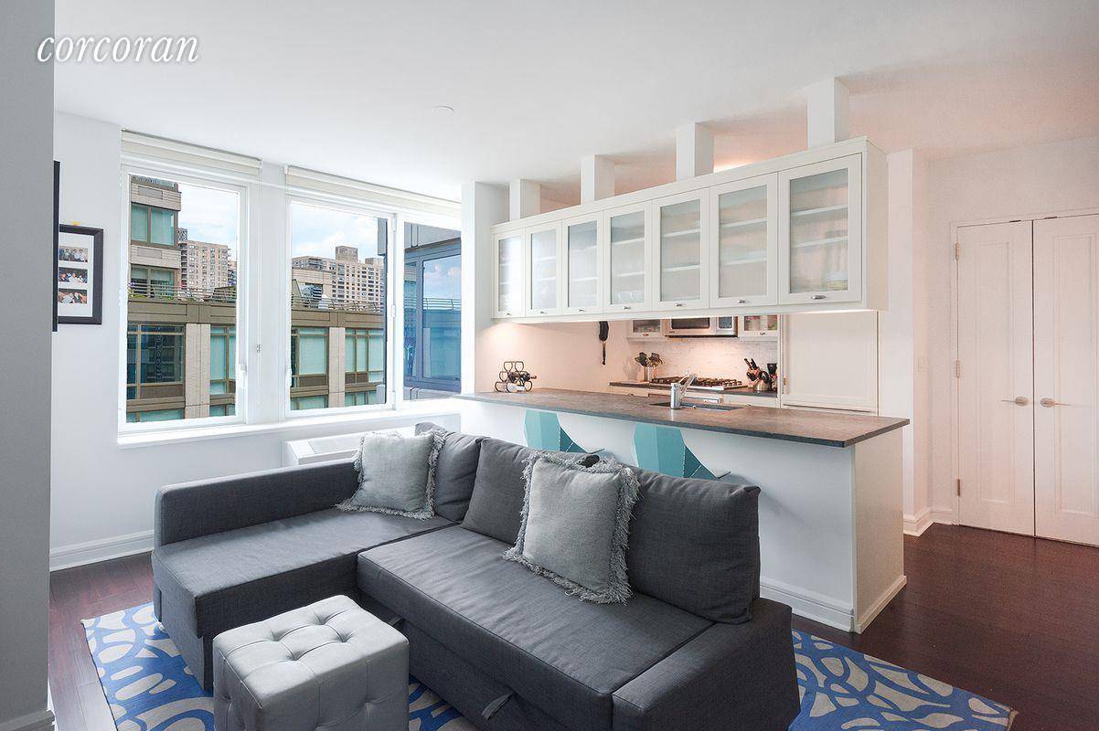 Apartment 14D at The Rushmore is a spacious one bedroom condo rental with side views of the Hudson River and Hudson River Park.
