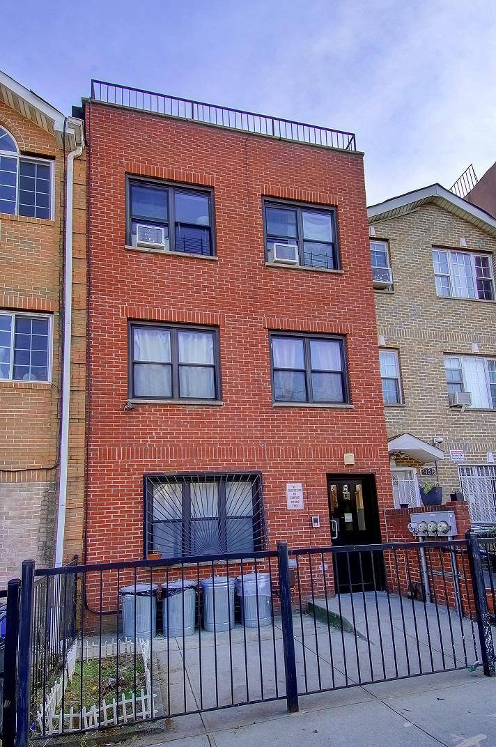 Newly built in 2004 legally zoned 3 family red Brisk Townhouse for Sale in Bushwick.