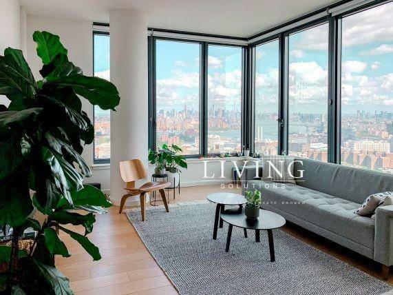 Inspiring 2BR 2BA corner unit with amazing views WIC and W D in unitThe panoramic view in the living room is absolutely stunning and stretches from the south of Manhattan ...
