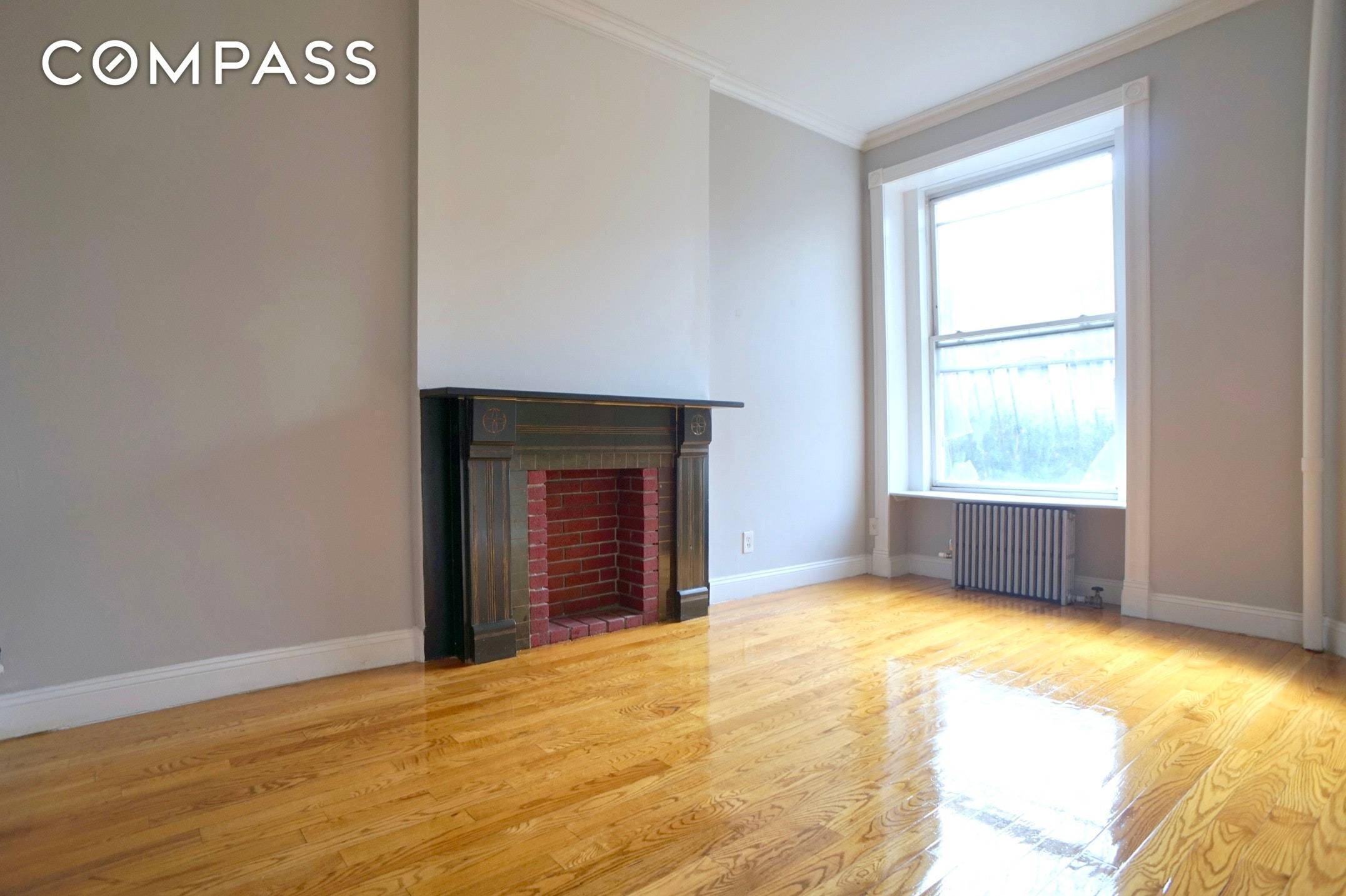 Renovated two bedroom, 1 bath apartment with two entrances, decorative and wood burning fireplaces, excellent storage and private outdoor space located minutes from the train in South Slope Greenwood.