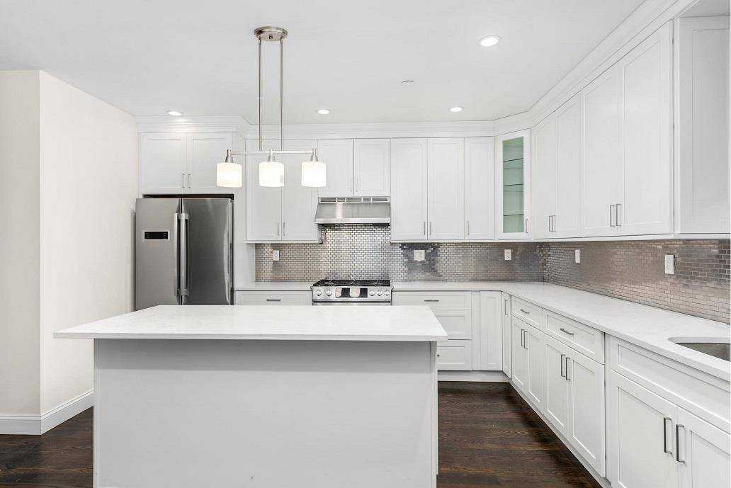 Enter your new stylish and modern townhome residence at 1992 Madison Avenue.