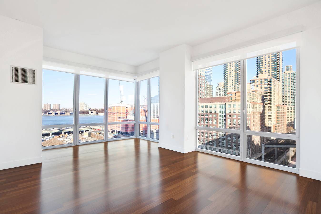 Luxury converted 2BR/1.5 bath corner apartment boasts river views with north, east and western exposure with floor-to-ceiling windows.