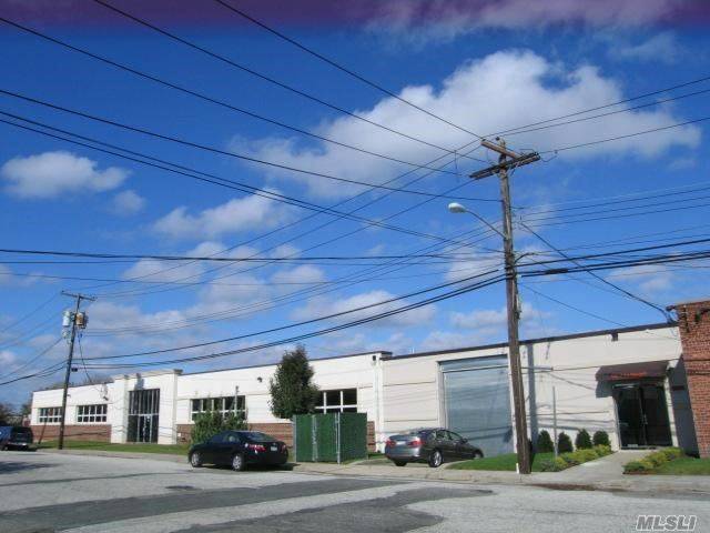 Large warehouse space with offices, reception area, 2 bathrooms and parking.