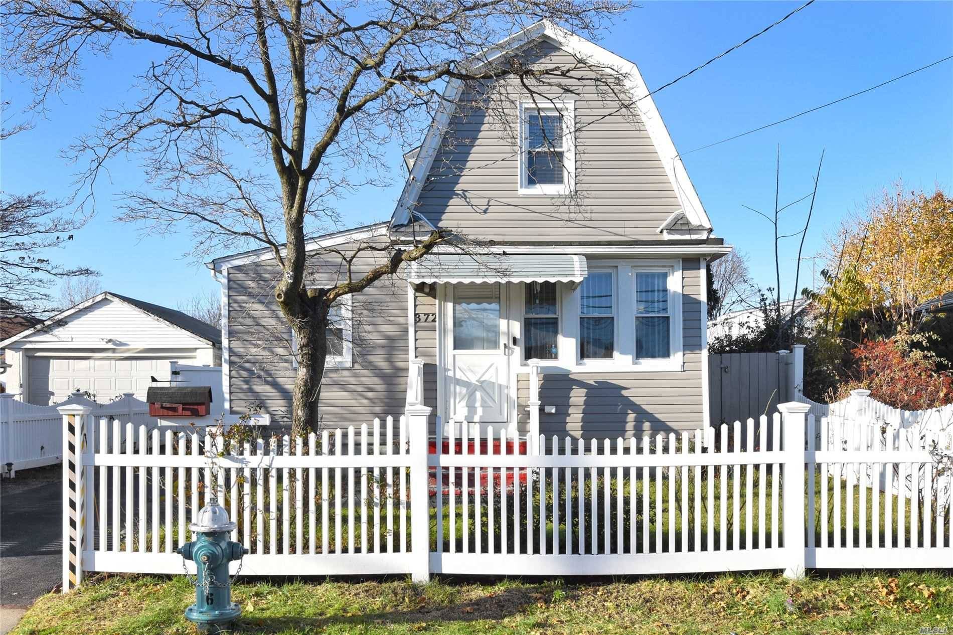 Charming Village Colonial complete with White Picket Fence !