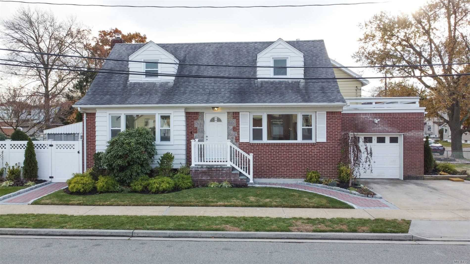 Completely Updated Wide Line Cape Walking Distance To The LIRR, Featuring New Kitchen With Quartz Counter Tops And Stainless Steel Appliances, Gleaming Hardwood Floors, Updated Bathrooms, New Roof, Stoop, Windows ...