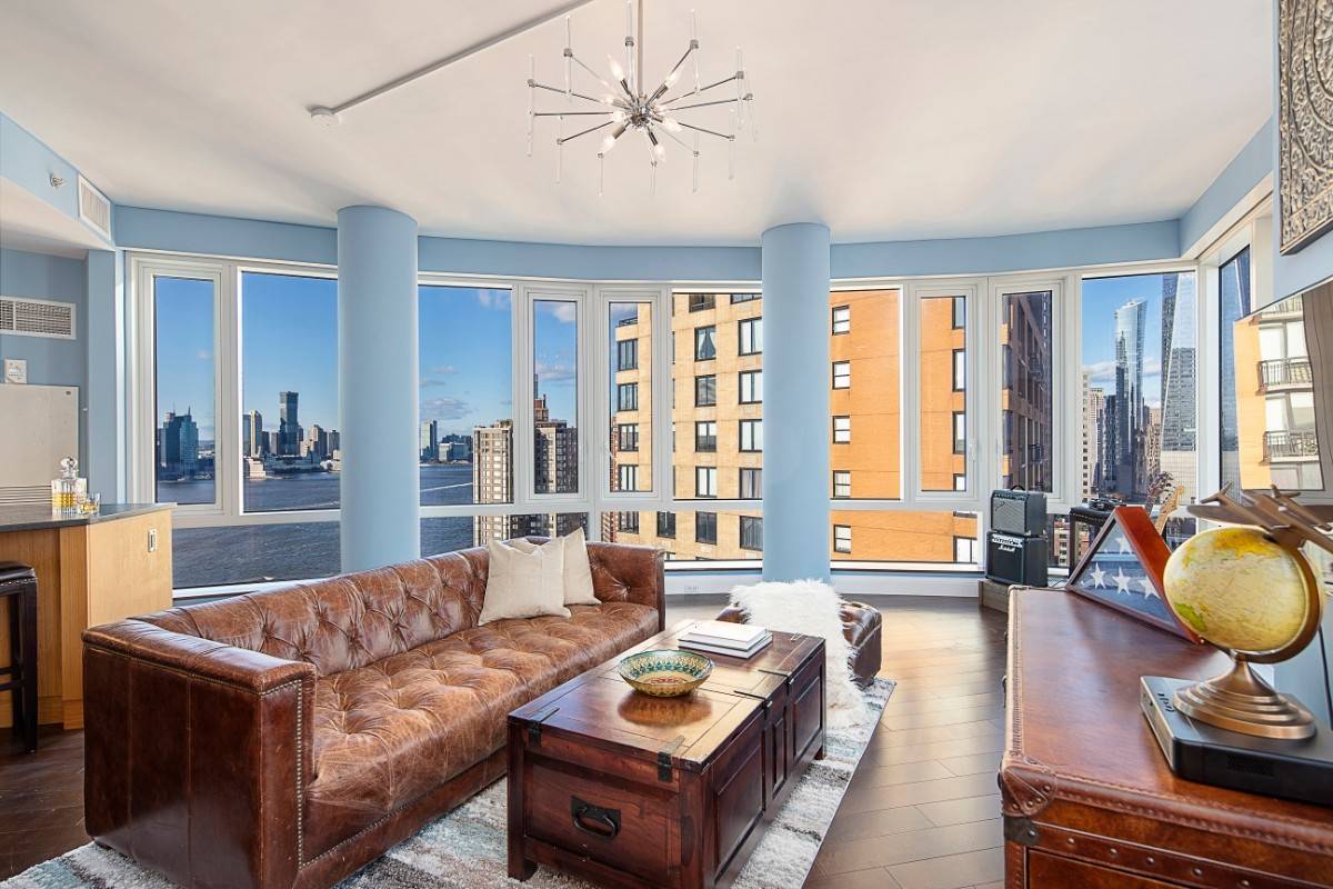 Wrapped floor to ceiling with expansive Hudson River and Downtown Manhattan views this corner unit at The Visionaire is filled with light from sun up to sundown.