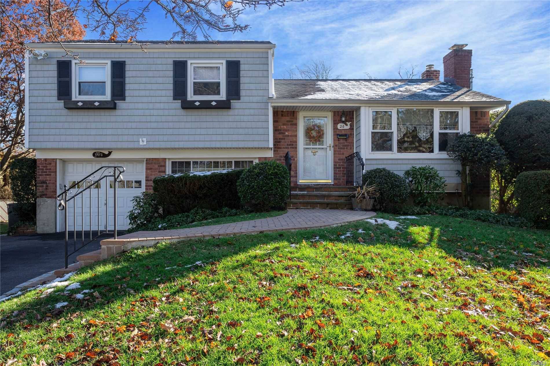 Location, Location this Lovely Home is a Stones Throw From Greenlawn Village and Lies in the Sought After, Award winning Elwood School ; District.