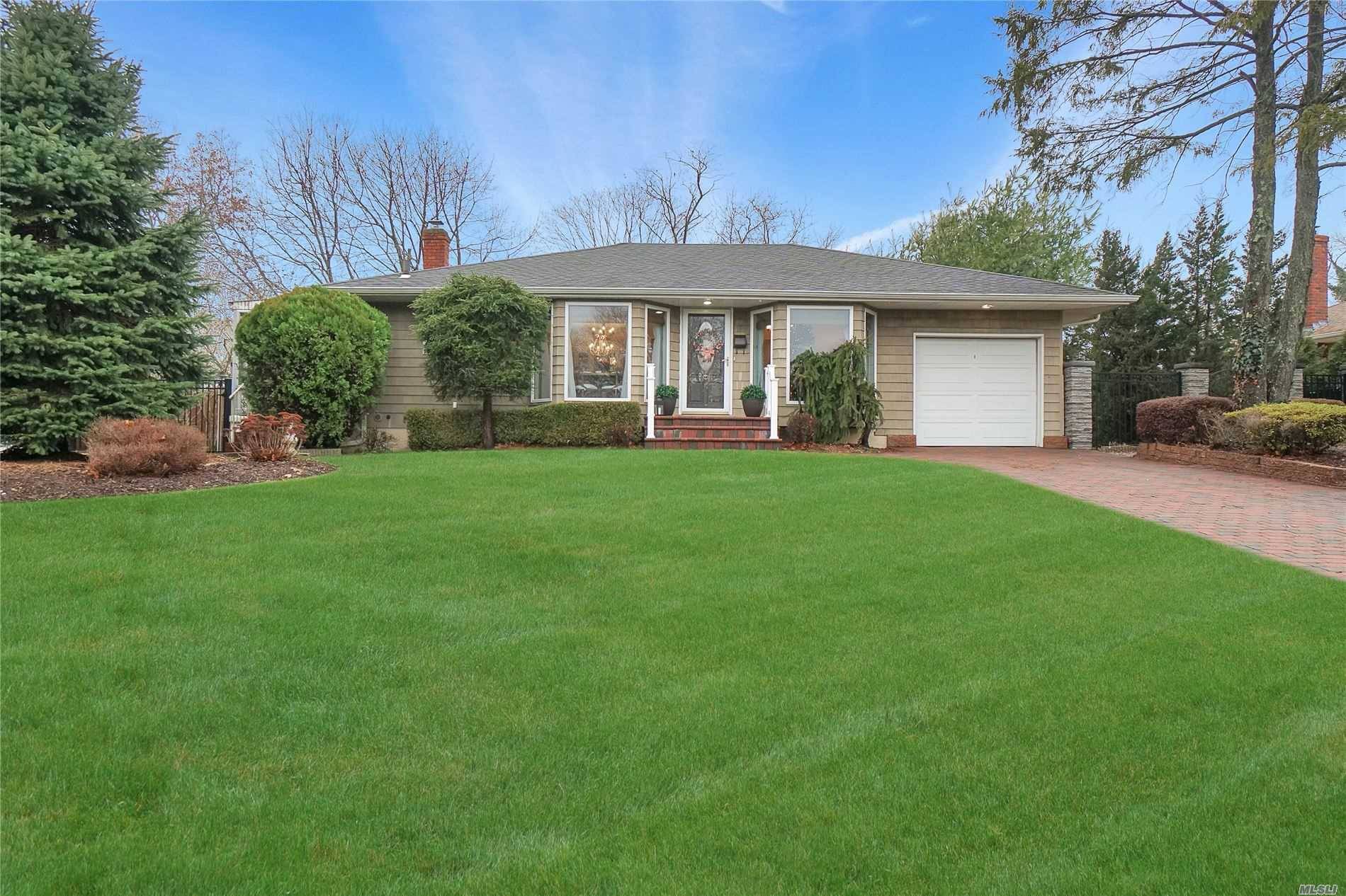 Welcome Home to this Diamond Ranch with Beautiful Curb Appeal in the Desirable College Section of East Hill Estates within the Smithtown SD.