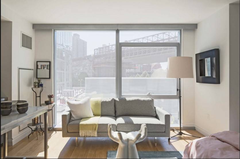 This South facing studio has a spacious living area, a walk in closet, in unit laundry and a wall of windows blasted with natural sunlight.
