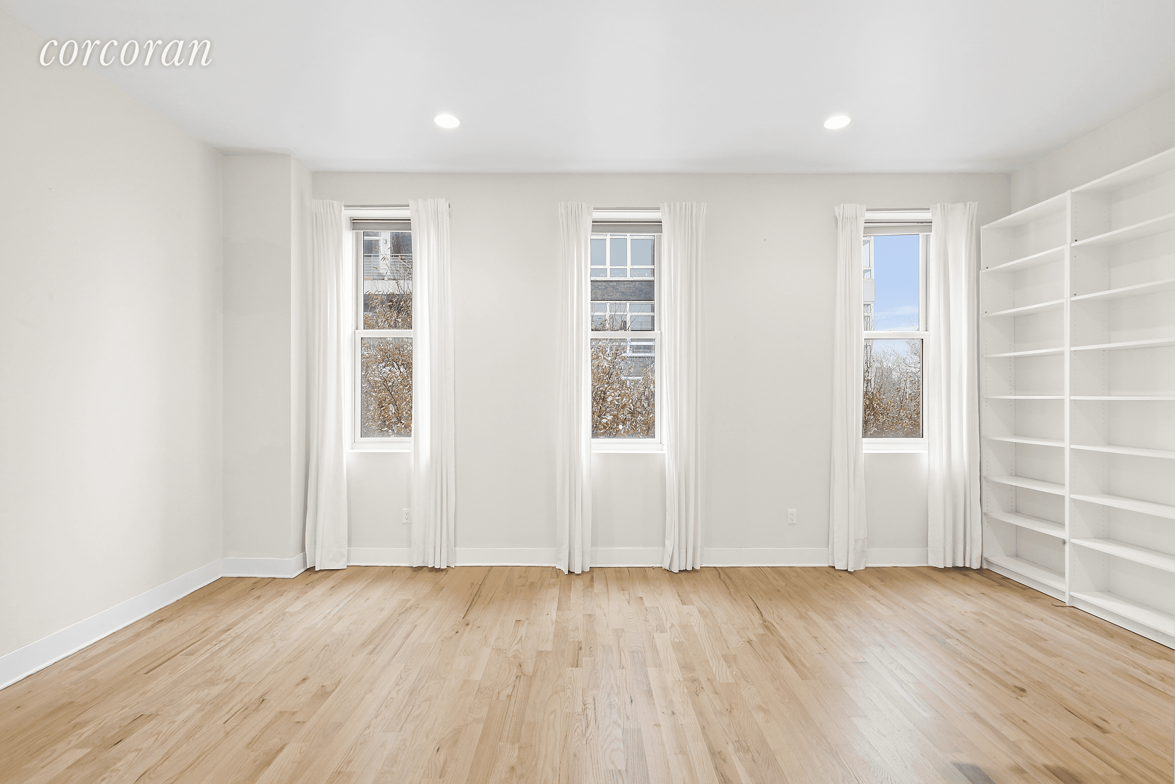 This parkside floor through duplex penthouse at the McCarren Condominium features three full bedrooms, two and a half baths and two private outdoor spaces.