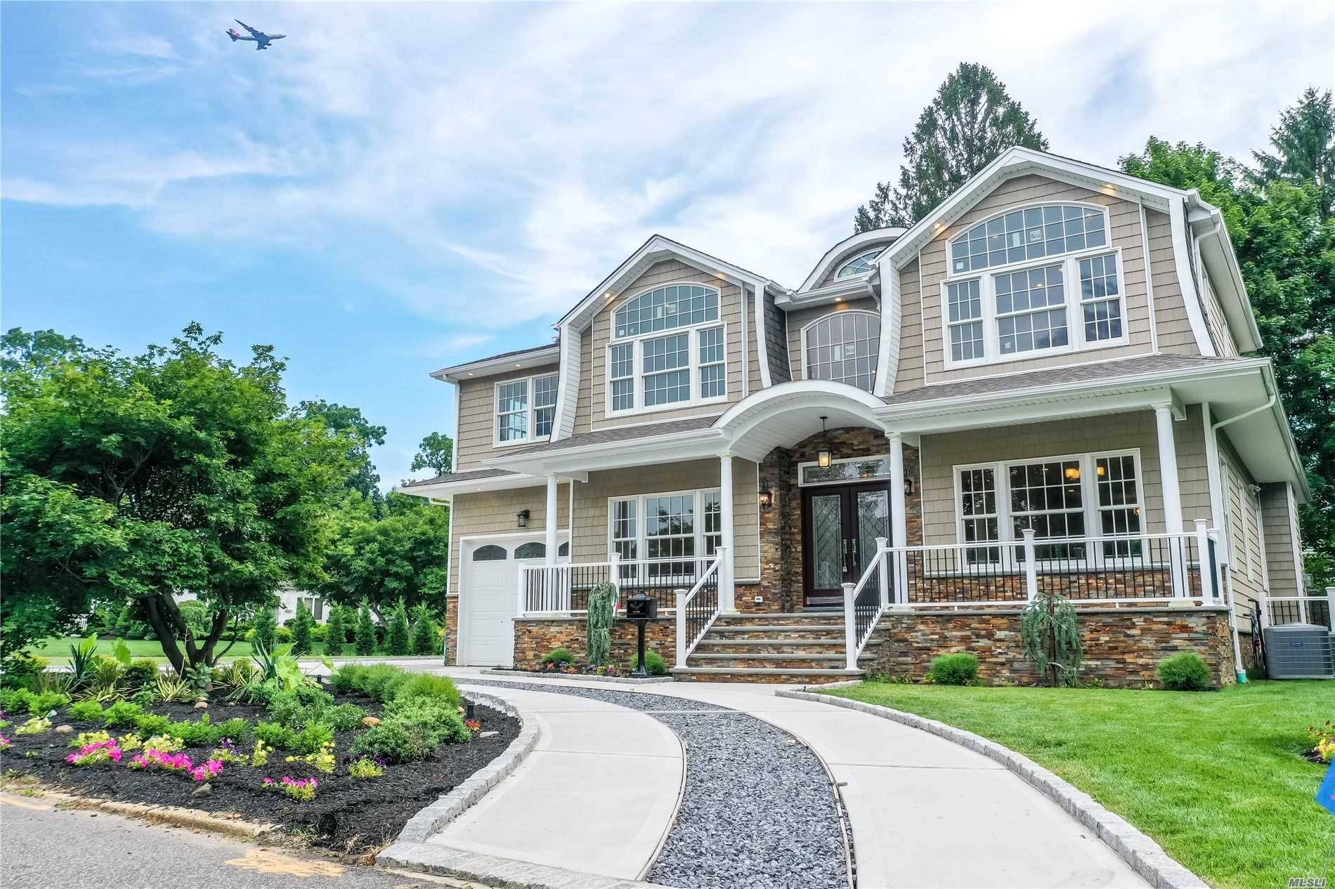 Live in this indisputable tranquility almost 4000 SF house on large property with circular driveway and gorgeous flower beds and landscape, designer porches, Trex deck with gas line for BBQ ...