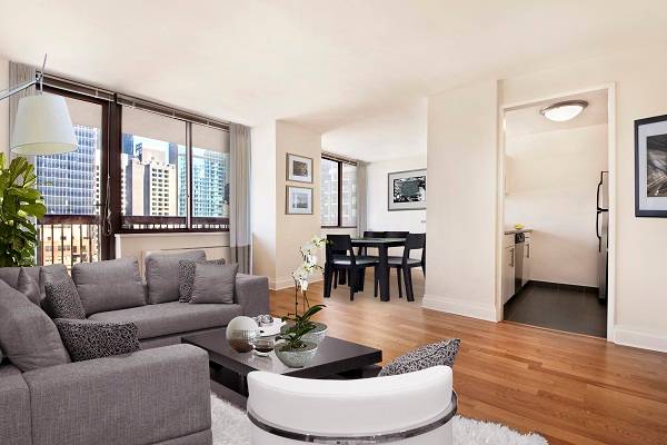 Penthouse Corner One Bedroom ** Wood Burning Fireplace ** Private Balcony ** Wall-of-Windows ** Gym, Bike Room, Laundry, 24hr Doorman * Pets OK * Close to Central Park ** Midtown