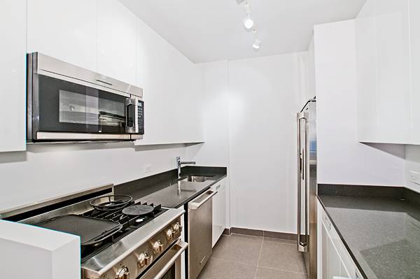 **NO FEE** Great Light in this  NEW Construction  ONE Bedroom with 14 foot ceiling in Art Deco Condo Conversion 