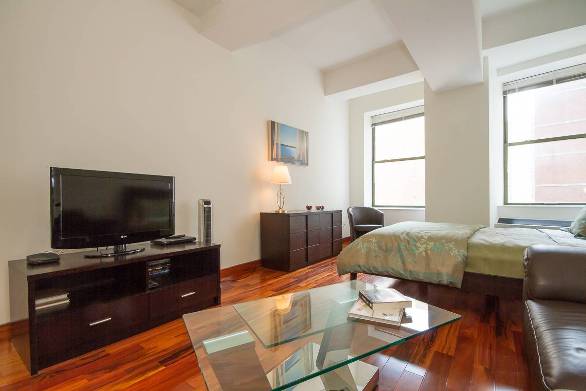 Elegantly furnished large studio, high ceiling with lots of closets at 99 John Condo with amazing amenities