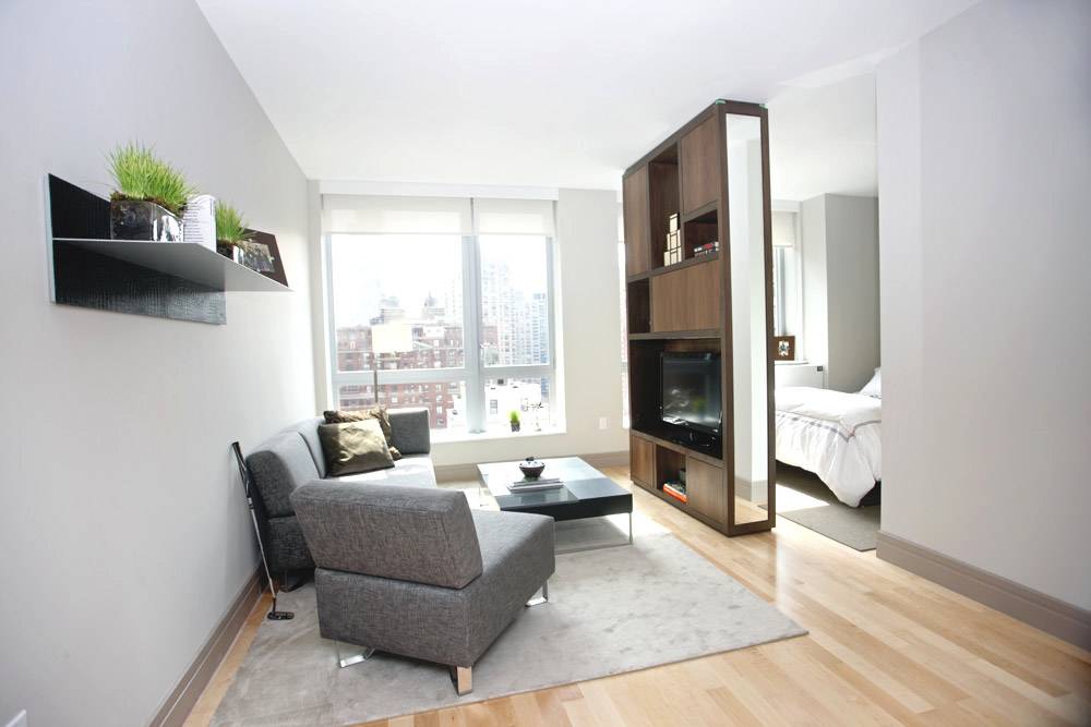 Ultra Modern Studio featuring high ceilings and large glass Windows, Open Kitchen, Dressing Area exposed to unobstructed view of the City.#Green living #Central Park #Whole Foods #TimeWarnerCenter #ColumbusCircle