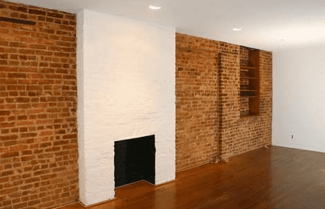 **Upper East Side exposed brick Studio with faux fireplace** $1,995