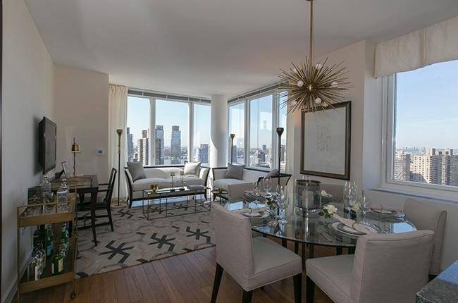 Breathtaking 52nd floor 4 bedroom apartment with balcony overlooking Lincoln Center and Central Park. Sprawling floorplan with mulitple walk in closets. Gorgeous new Luxury building with swimming pool and more ! Free rent. No fee.