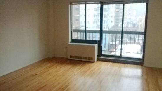 Elevator Alcove Studio in Murray Hill w/ Laundry and Central Air Conditioning.