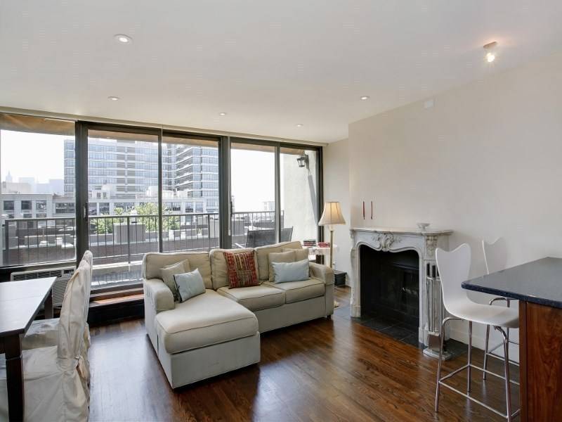 RARE! Fully renovated duplex penthouse condo with private terrace in prime West Village.