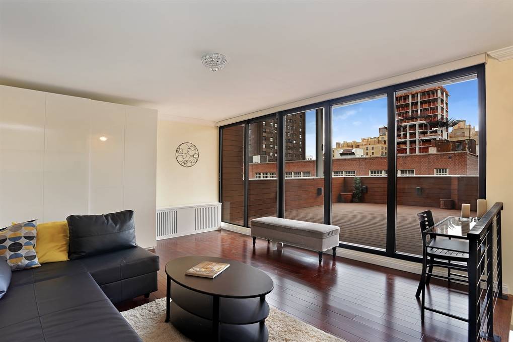 GRAMERCY- A high-end duplex PENTHOUSE set up as a two bedrooms - 24 X 7 DOORMAN- ROOFDECK- BALCONY