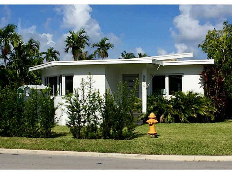 A charming mid-century modern style Miami home situated on a corner lot in up and coming Surfside