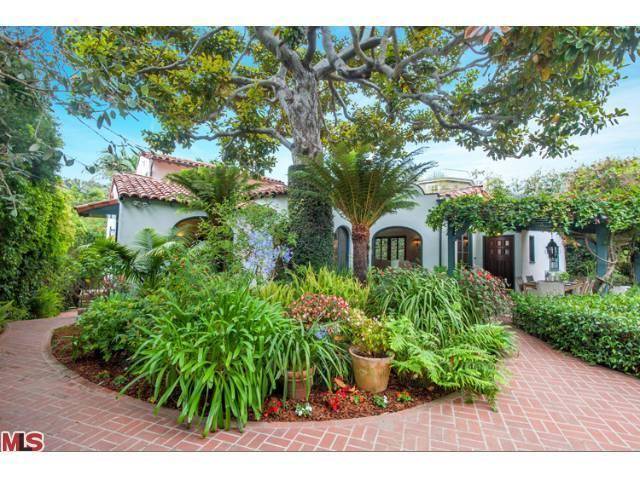 THIS HOME IS A BEAUTIFUL PRIVATE SPANISH 4 BD + 4BA JEWEL HIDDEN BEHIND GATES & AN ENCHANTED GARDEN