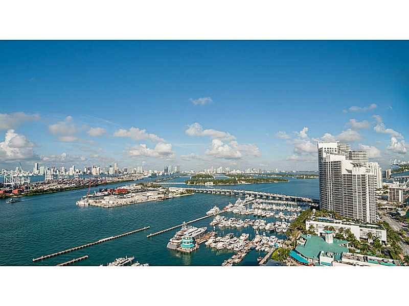 Upgraded corner unit in the Yacht Club with unobstructed views of the Water & Downtown Miami