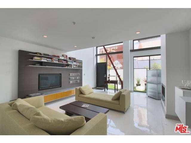 State-of-the-art modern live/work loft features white polished concrete floors