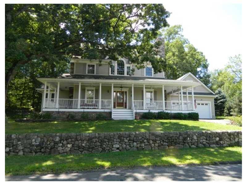 Enter this beautiful custom built home from a large wraparound porch that has a stunning view