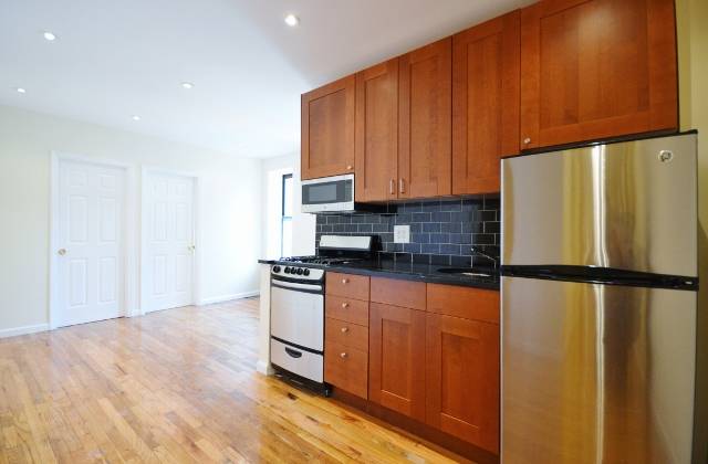 East Village: Fully Gut Renovated Sunny 2 Bedroom Apartment For Rent with Stainless Steel Appliances