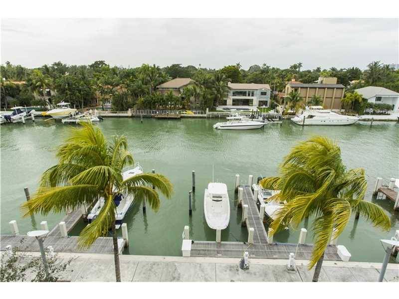 Rare opportunity to own a stunning waterfront townhome on the exclusive and private Aqua at Allison Island
