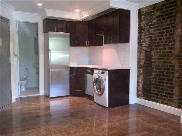 Live like a true New Yorker in this Charming Exposed Brick wall Studio in the heart of E. Village 