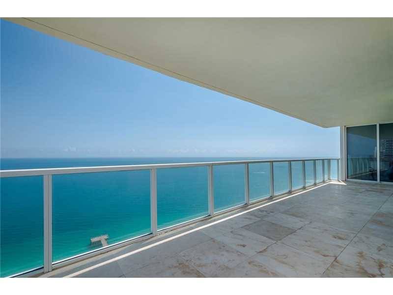 This direct beachfront condo is one of the most beautiful residences in La Perla building with unobstructed ocean and city views from each room