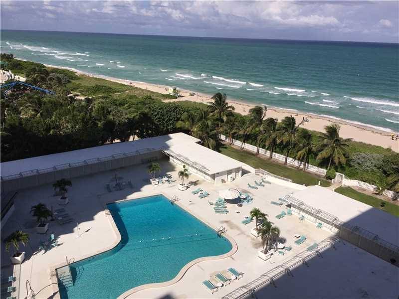 This remodeled unit has an amazing view of the ocean and the beach as you walk in