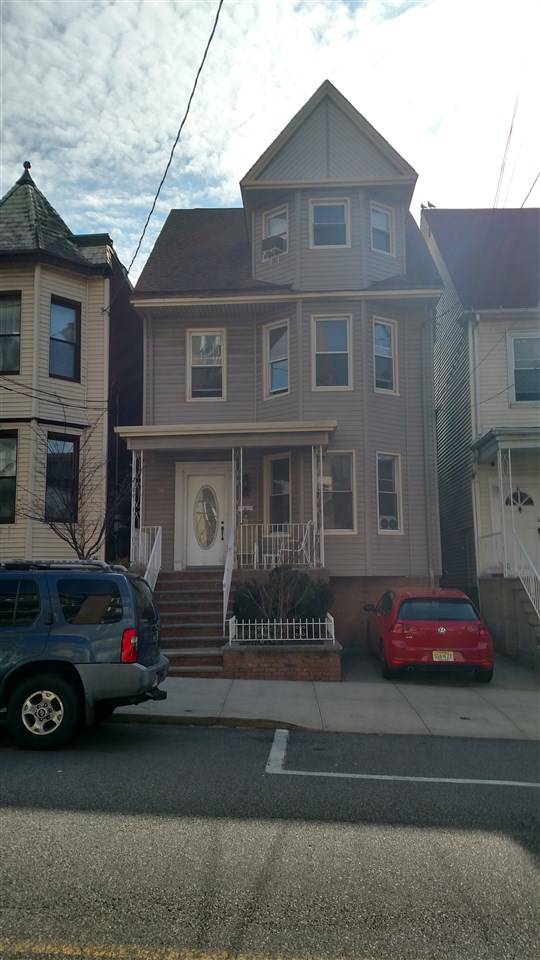 OFFERED FOR SALE THIS 5 BEDROOM PROPERTY WITH PAVED DRIVEWAY LOCATED HALF A BLOCK AWAY FROM JFK BOULEVARD EAST