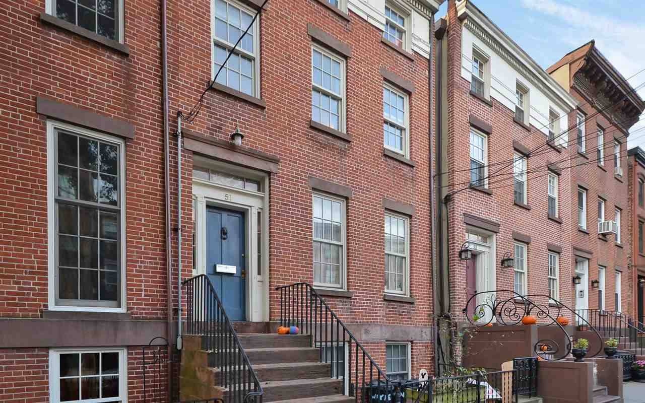 Welcome home to this 22 foot wide two family brick rowhouse in the heart of Downtown Jersey City