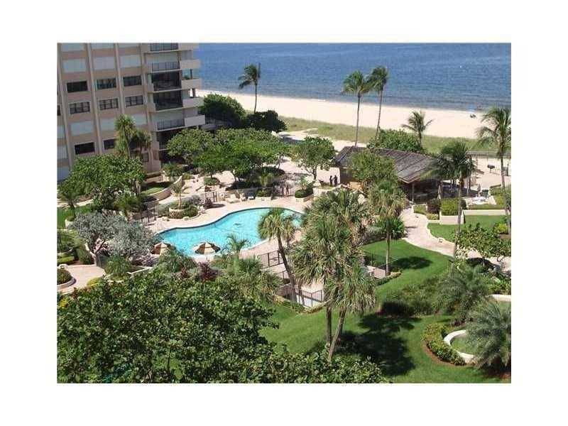 ENJOY THE FINE BEACH RESORT LIVING AT THIS IMPECCABLE FULLY FURNISHED OCEANFRONT