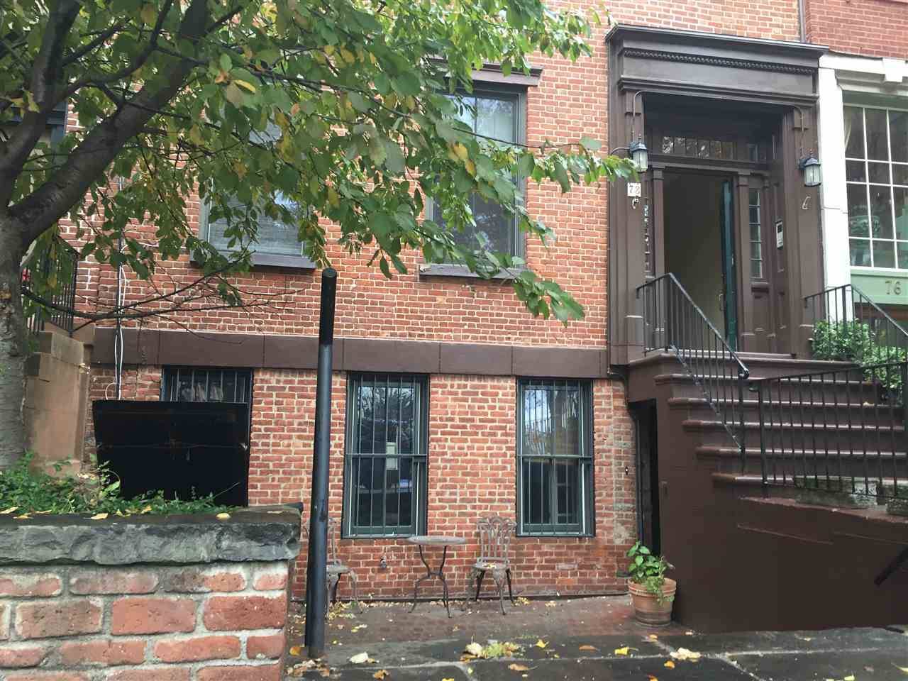 Welcome to this Paulus Hook row house with exclusive front yard & a private entry door