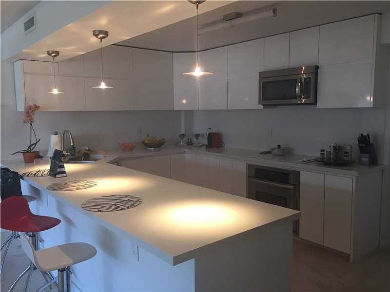 Spacious bright modern just remodeled 2/2 in exclusive oceanfront condo Marble floors SS appliances whit wood cabinetry