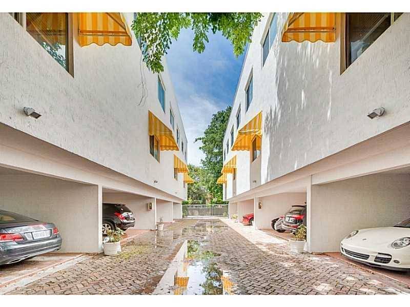 Fantastic contemporary two story townhouse located in gated complex in the heart of Coconut Grove