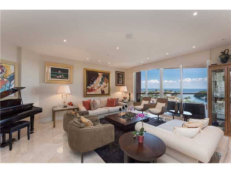 Highly sought after center line unit at The Gables Club features fabulous views of Biscayne Bay and the Miami skyline from every room