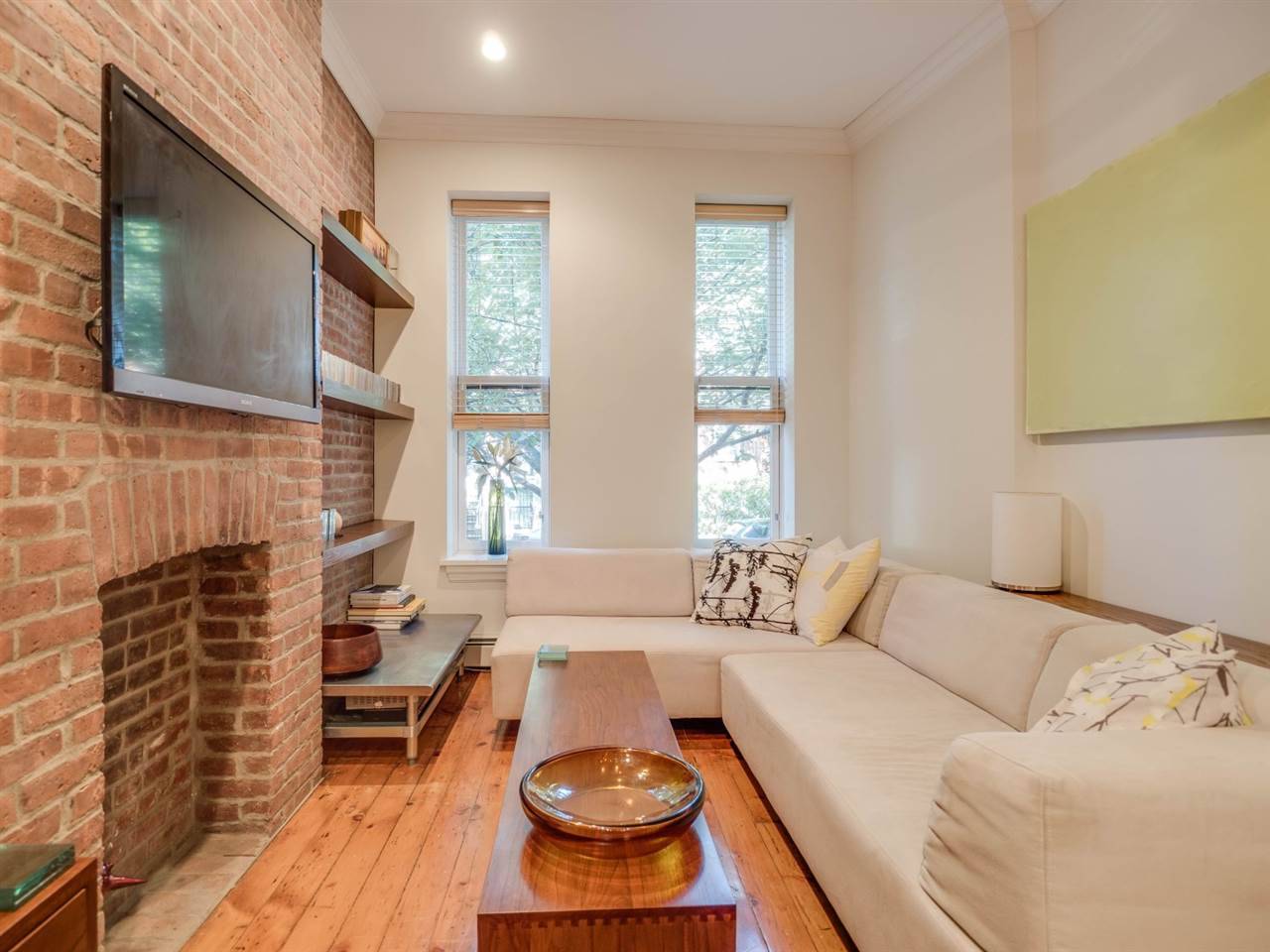 Come home to this beautiful condo on a picturesque tree lined street in Downtown Jersey City
