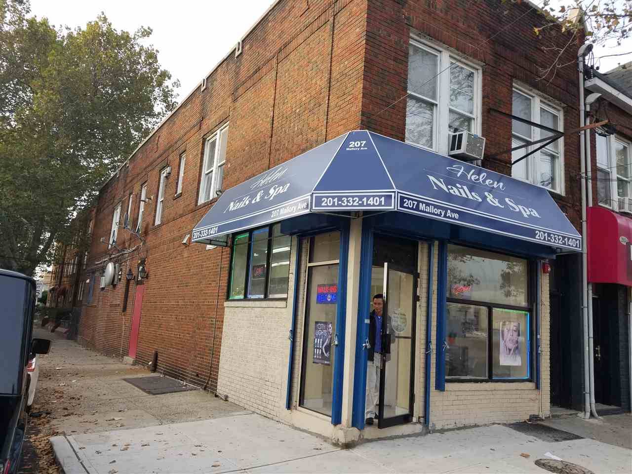 Profitable all brick corner property with commercial space and two 2 bedroom units above