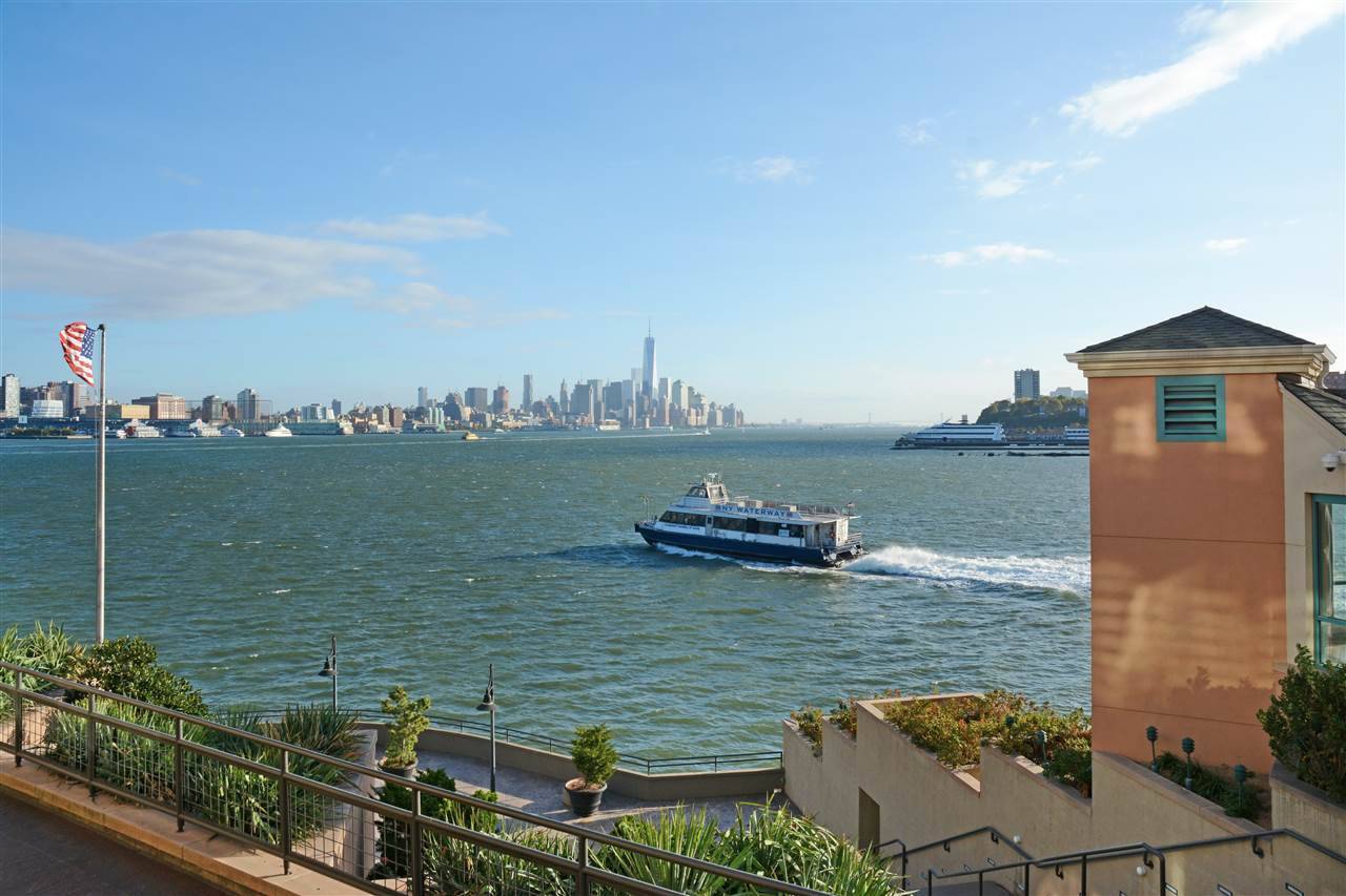Uniquely designed waterfront duplex style condo with amazing South East views of Freedom Tower