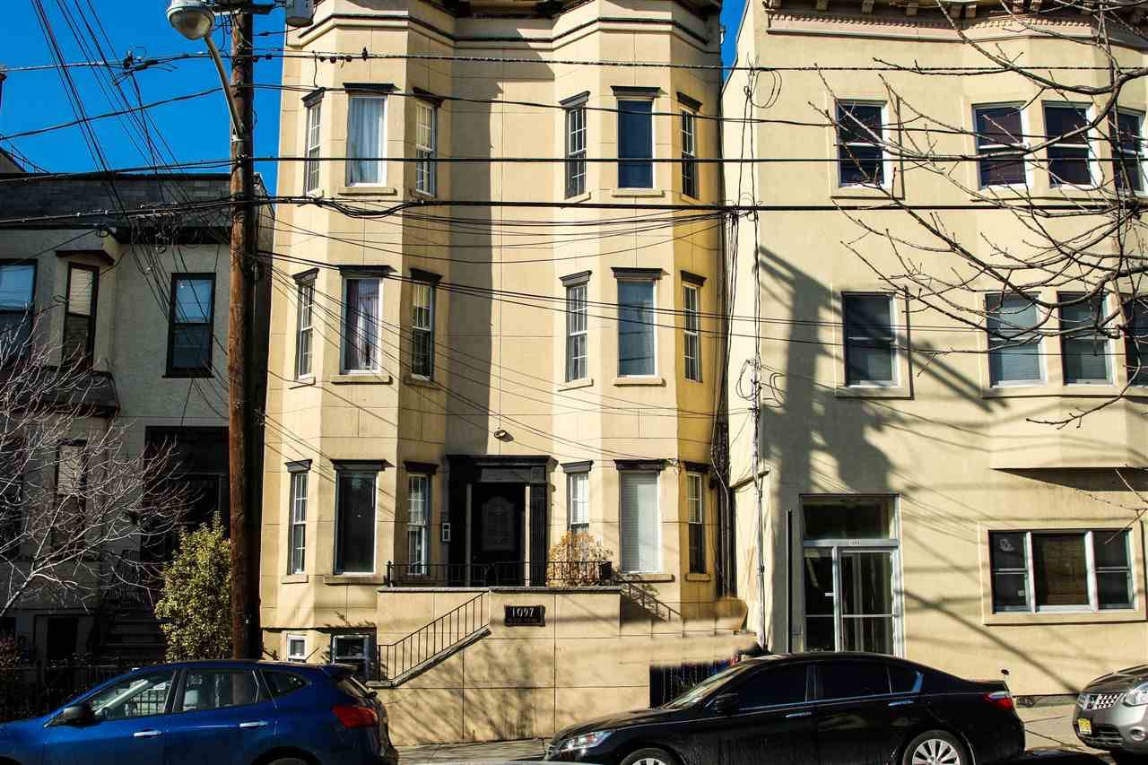 Welcome home to a renovated 3 BD/2BA duplex brownstone apartment featuring a variety of luxurious upgrades in the prime location of JC Heights