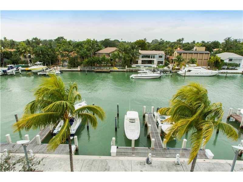 Rare opportunity to own a stunning waterfront townhome on the exclusive and private Aqua at Allison Island