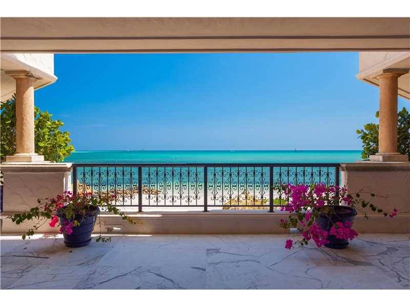 Experience this Fisher Island Stunning Ocean Direct unit with unique wraparound terraces and access to the private beach