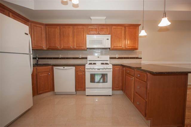 Brand new 3 bedroom/2 bath unit with hard wood floors throughout