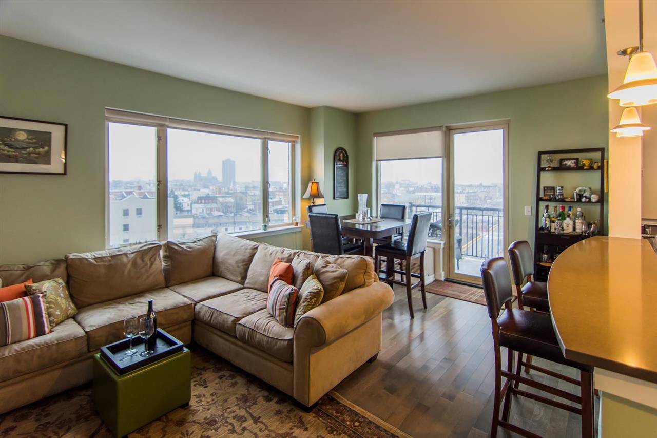 Beautifully appointed 2 Bed 2 Bath south facing corner unit bathed in light with private balcony